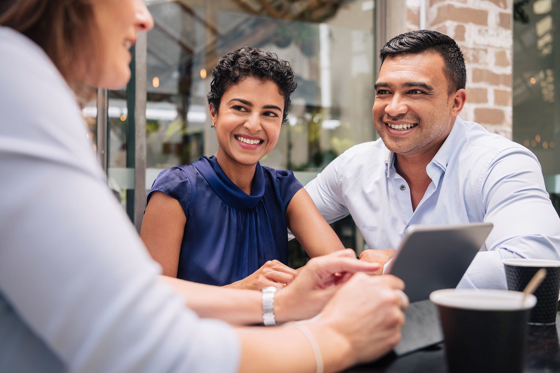 Young couple talking to their financial advisor